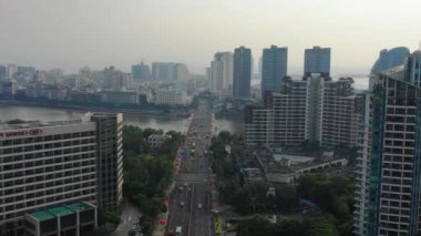 Aerial topdown view of Sanya riverside street traffic, Hainan island, China, 4k 