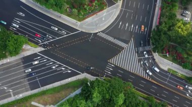 Aerial topdown view of Sanya riverside street traffic, Hainan island, China, 4k 