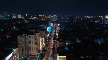 Aerial topdown view of Sanya riverside street traffic, Hainan island, China, 4k 