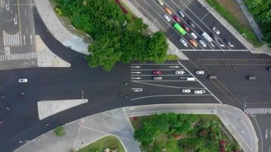 Aerial topdown view of Sanya riverside street traffic, Hainan island, China, 4k 