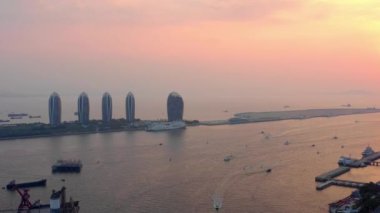 Aerial panorama of Sanya city at sunset time, 4k. Hainan island, China