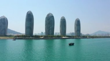 Aerial panorama of famous hotel complex at Sanya city, daytime, 4k. Hainan island, China
