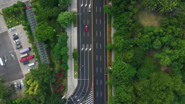 Aerial topdown view of Sanya riverside street traffic, Hainan island, China, 4k 