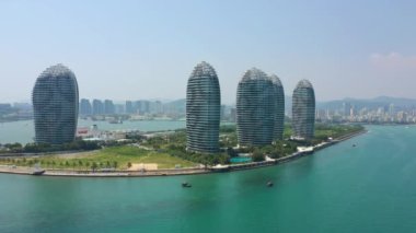 Aerial panorama of famous hotel complex at Sanya city, daytime, 4k. Hainan island, China