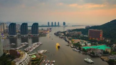 Aerial panorama of Sanya cityscape at sunset. China, timelapse, 4k 