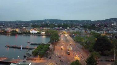 Alacakaranlık manzaralı Zürih göl kenarındaki İsviçre Körfezi, 4k 