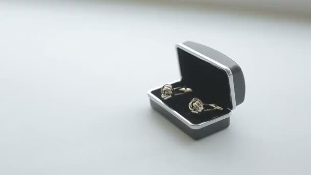 Luxury golden cuff links in a box isolated — Stock Video