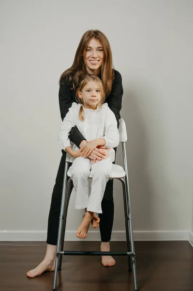 Gorgeous Young Mother Hugging Her Daughter Who Sitting Bar Stool — Stock Photo, Image