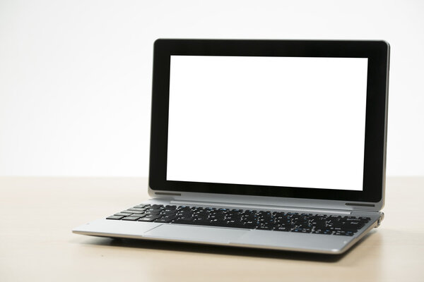 Front view of Laptop / Tablet on a Wooden table
