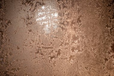Texture Background Of Frosty Pattern On Window In Winter Evening Close Up.