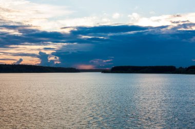 Evening Landscape River Under Dramatic Sky In Summer.