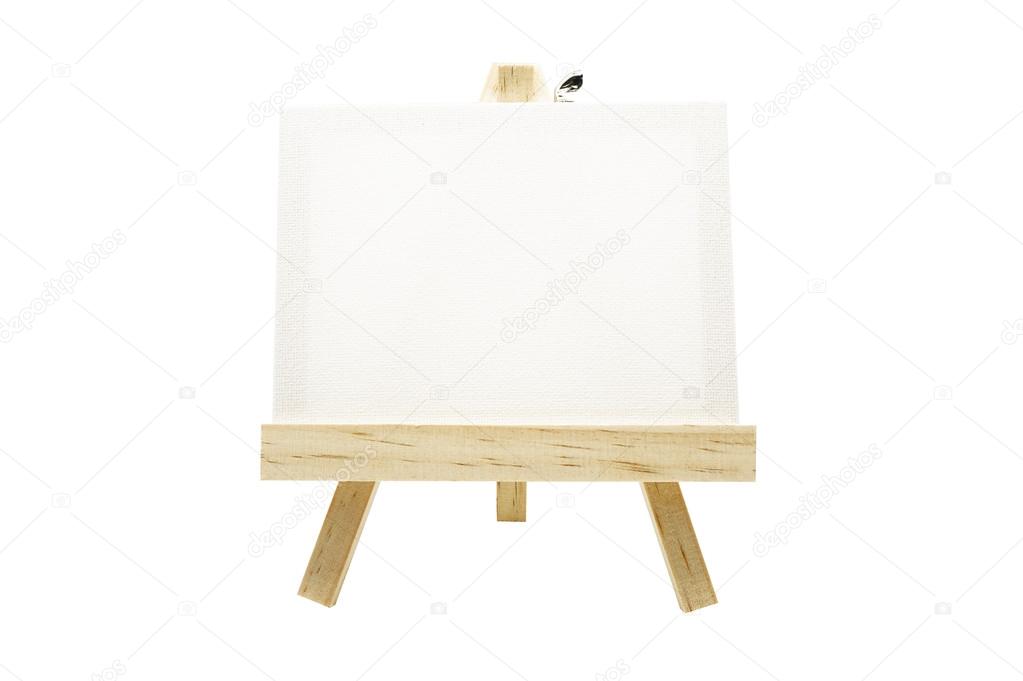 Mini wooden easel with blank canvas frame isolated