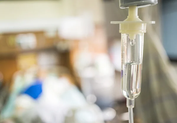 Closeup saline intravenous (IV) drip for patient in hospital. — Stock Photo, Image