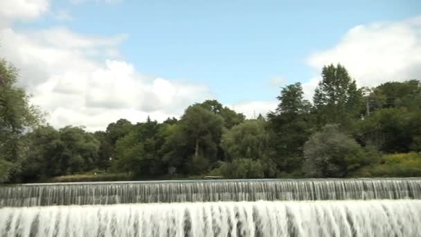 Panorama view. Waterfall and an old church. — Stock Video