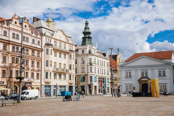 Golden gilded fountain and colorful renaissance historical buildings in main Republic square of Plzen in sunny day, Cultural landmark, Pilsen, Western Bohemia, Czech Republic, May 29, 2021