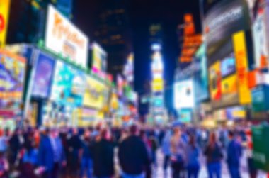 View of Times Square at night in New York City with blurred effect clipart