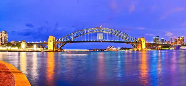 View of Sydney Harbor Bridge and Opera House at night Stock Picture