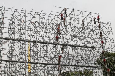 The installers are building a huge metal structure