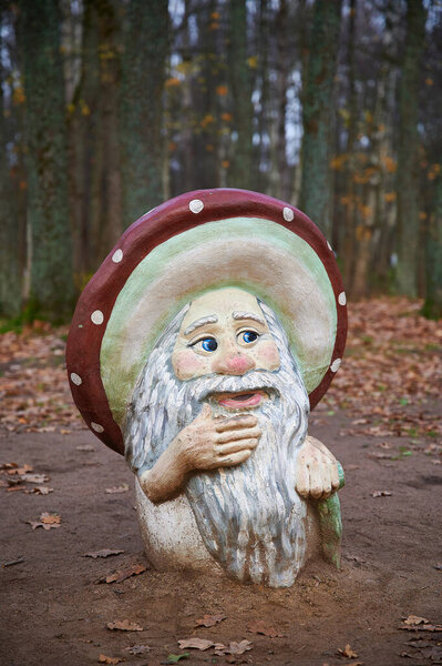 St. Petersburg, Russia - November 4, 2020: Park Dubki in Sestroretsk. Children's playground with sculptures of fairy-tale characters. The old man is a forest man in a hat in the form of a mushroom