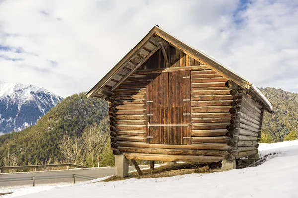 Log cabin in a winter landscape