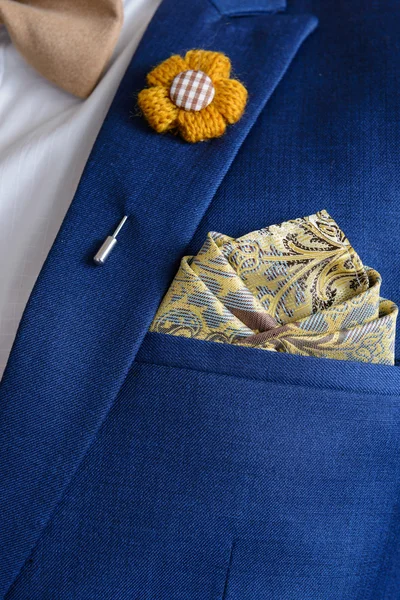 man in blue suit bowtie, pocket square
