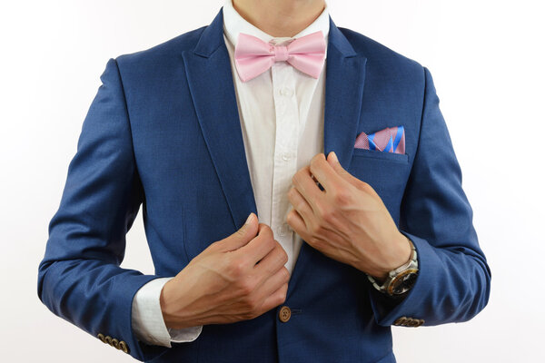 man in blue suit bowtie, pocket square