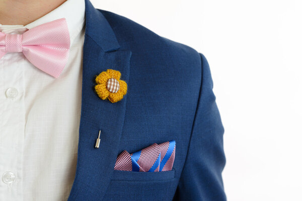 man in blue suit bowtie, pocket square