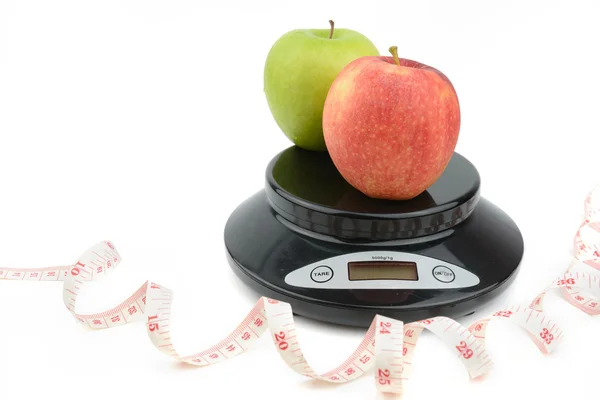 Black digital scale, weight green apple — Stock Photo, Image