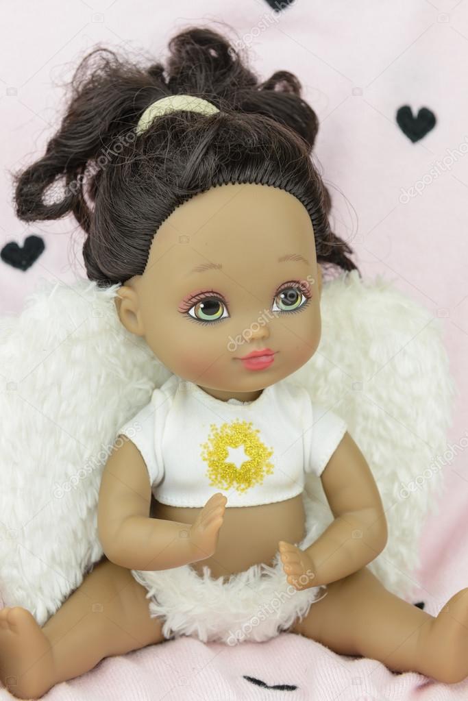 black skin doll wearing angel suit and wings, girl