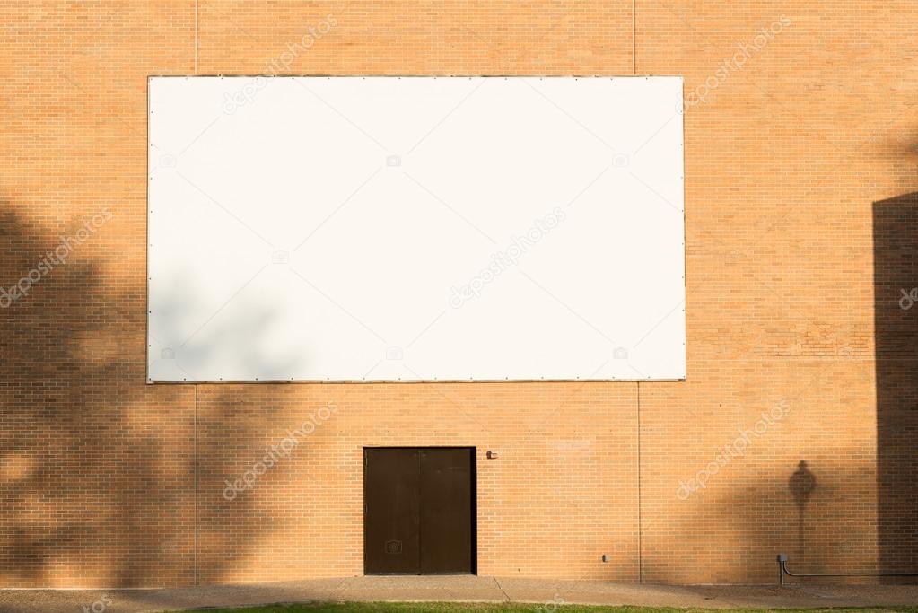 big blank billboard attached to brick wall