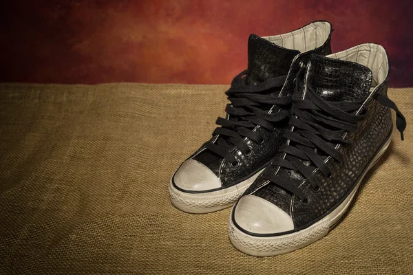 Bodegón negro zapatos, botas — Foto de Stock
