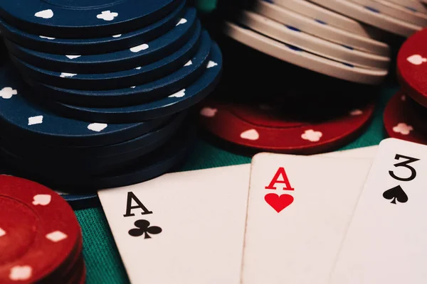 Cards with one pair of aces in poker on the background of gaming chips — Stock Photo, Image