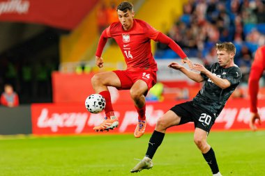 Jakub Kiwior and Callum McCowatt seen  during International friendly game between national teams of Poland and  New Zealand (Maciej Rogowski/Ball Raw Images)