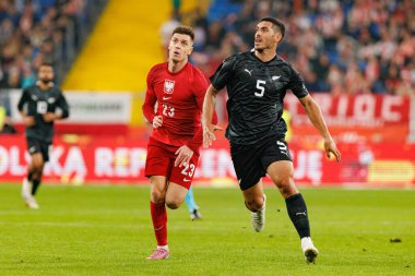 Krzysztof Piatek and Michael Boxall  seen  during International friendly game between national teams of Poland and  New Zealand (Maciej Rogowski/Ball Raw Images)