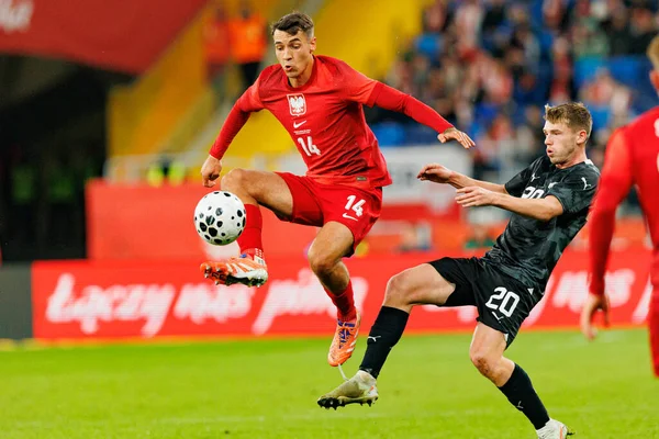 Jakub Kiwior and Callum McCowatt seen  during International friendly game between national teams of Poland and  New Zealand (Maciej Rogowski/Ball Raw Images)
