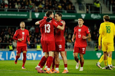 Polonyalı oyuncular, 2026 Dünya Kupası 'nda Litvanya ve Polonya milli takımları arasında oynanan Avrupa Ön eleme maçında Robert Lewandowski' den gol üstüne gol atarken görüldü (Maciej Rogowski / Ball Raw Images)