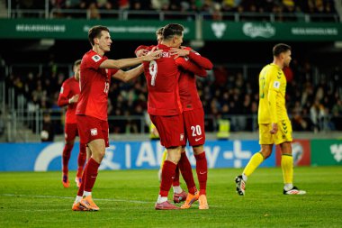 Jakub Kaminski, Robert Lewandowski ve Sebastian Szymanski, 2026 Dünya Kupası 'nda Litvanya ve Polonya milli takımları arasında oynanan Avrupa ön eleme maçında gol attıktan sonra kutlama yaparken görüldü (Maciej Rogowski / Ball Raw Images))