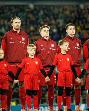 Przemyslaw Wisniewski, Michal Skoras ve Jakub Kaminski, 2026 Dünya Kupası 'nda Litvanya ve Polonya milli takımları arasında oynanan Avrupa eleme maçında görüldü (Maciej Rogowski / Ball Raw Images))