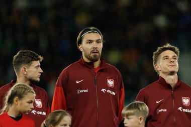 Sebastian Szymanski, Przemyslaw Wisniewski ve Michal Skoras, 2026 Dünya Kupası 'nda Litvanya ve Polonya milli takımları arasında oynanan Avrupa eleme maçında görüldü (Maciej Rogowski / Ball Raw Images))