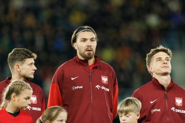 Sebastian Szymanski, Przemyslaw Wisniewski ve Michal Skoras, 2026 Dünya Kupası 'nda Litvanya ve Polonya milli takımları arasında oynanan Avrupa eleme maçında görüldü (Maciej Rogowski / Ball Raw Images))