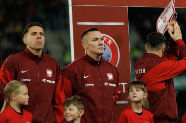 Jan Bednarek, Lukasz Skorupski ve Robert Lewandowski, 2026 Dünya Kupası 'nda Litvanya ve Polonya milli takımları arasında oynanan Avrupa eleme maçında görüldü (Maciej Rogowski / Ball Raw Images)