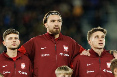 Sebastian Szymanski, Przemyslaw Wisniewski ve Michal Skoras, 2026 Dünya Kupası 'nda Litvanya ve Polonya milli takımları arasında oynanan Avrupa eleme maçında görüldü (Maciej Rogowski / Ball Raw Images))