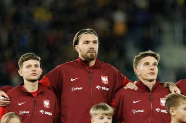 Sebastian Szymanski, Przemyslaw Wisniewski ve Michal Skoras, 2026 Dünya Kupası 'nda Litvanya ve Polonya milli takımları arasında oynanan Avrupa eleme maçında görüldü (Maciej Rogowski / Ball Raw Images))