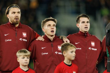 Przemyslaw Wisniewski, Michal Skoras ve Jakub Kaminski, 2026 Dünya Kupası 'nda Litvanya ve Polonya milli takımları arasında oynanan Avrupa eleme maçında görüldü (Maciej Rogowski / Ball Raw Images))