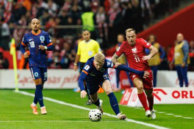 Jerdy Schouten ve Kamil Grosicki, 2026 Dünya Kupası eleme maçında Polonya ve Hollanda milli takımları arasında görüldü (Maciej Rogowski / Ball Raw Images)