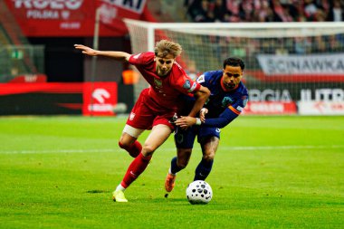 Jan Ziolkowski ve Justin Kluivert, 2026 Dünya Kupası eleme maçında Polonya ve Hollanda milli takımları arasında görüldü (Maciej Rogowski / Ball Raw Images)