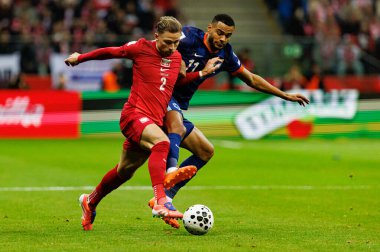 Matty Cash ve Cody Gakpo, 2026 Dünya Kupası eleme maçında Polonya ve Hollanda milli takımları (Maciej Rogowski / Ball Raw Images)