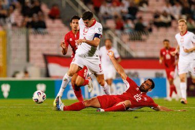 Robert Lewandowski ve Zach Muscat, 2026 Dünya Kupası eleme maçında Malta ve Polonya milli takımları arasında görüldü (Maciej Rogowski / Ball Raw Images)
