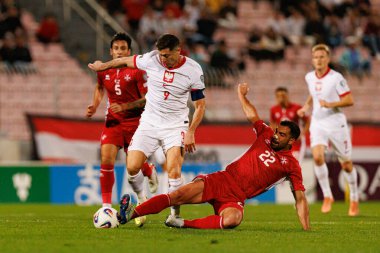 Robert Lewandowski ve Zach Muscat, 2026 Dünya Kupası eleme maçında Malta ve Polonya milli takımları arasında görüldü (Maciej Rogowski / Ball Raw Images)