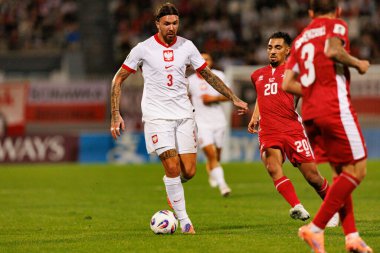 Przemyslaw Wisniewski ve İlyas Chouaref, 2026 Dünya Kupası eleme maçında Malta ve Polonya milli takımları arasında görüldü (Maciej Rogowski / Ball Raw Images)